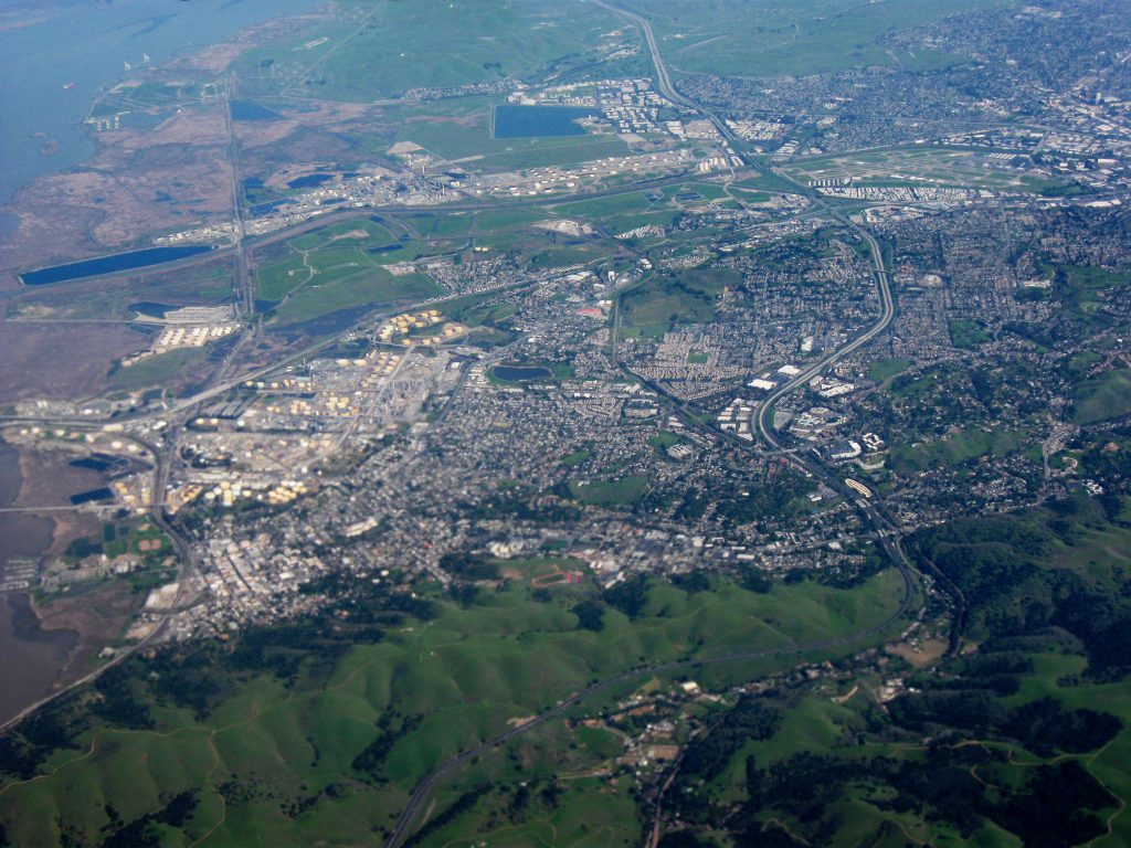 Aerial view of the City of Martinez, facing east, with Carquinez Strait on the left side and Highway 4 running up the right side