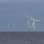 Floating wind turbines in the ocean.