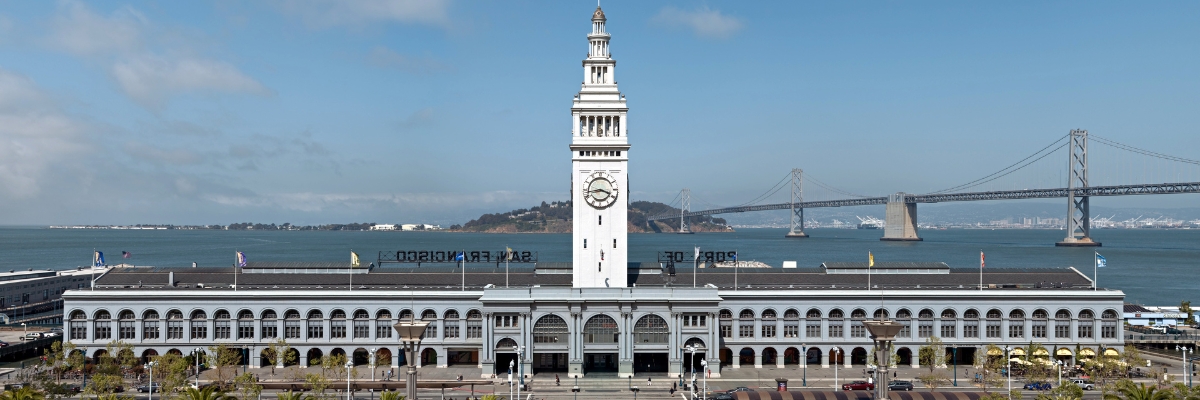 The Ferry Building is a terminal for ferries on the San Francisco Bay and an upscale shopping center located on The Embarcadero in San Francisco, California. The Bay Bridge can be seen in the background.