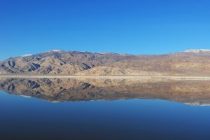 Owens Lake reflecting the mountain and sky. Links to full size image.