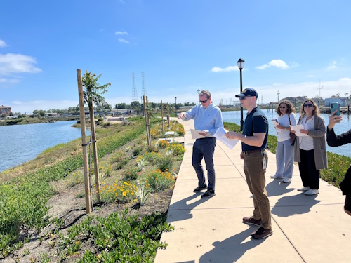 Two men on a sidewalk along the Redwood City Waterfront during the June Bay Area Public Trust Project site visit. 