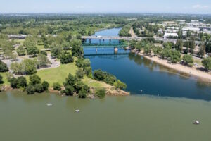 A drone photo shows boats in the Sacramento River near the confluence with the American River — spanned by Interstate 5 — at Discovery Park in Sacramento, California. Photo taken May 17, 2024. Photo courtesy of Xavier Mascareñas / California Department of Water Resources