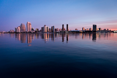 The San Diego skyline reflects in San Diego Bay during an early morning sunrise. Photo taken January 9, 2013.