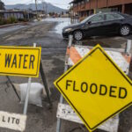 A vehicle is shown after detouring to avoid standing water on Gate 5 Road in Sausalito, CA near high tide as a King Tide’s effect is seen December 15, 2020, elevating the usual high water marks in Marin County. Andrew Innerarity/ California Department of Water Resources